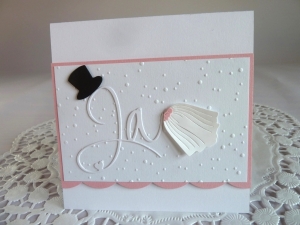 Edle Hochzeitskarte in weiß/rosa mit Prägung, Ja-Schriftzug, Zylinder und Schleier